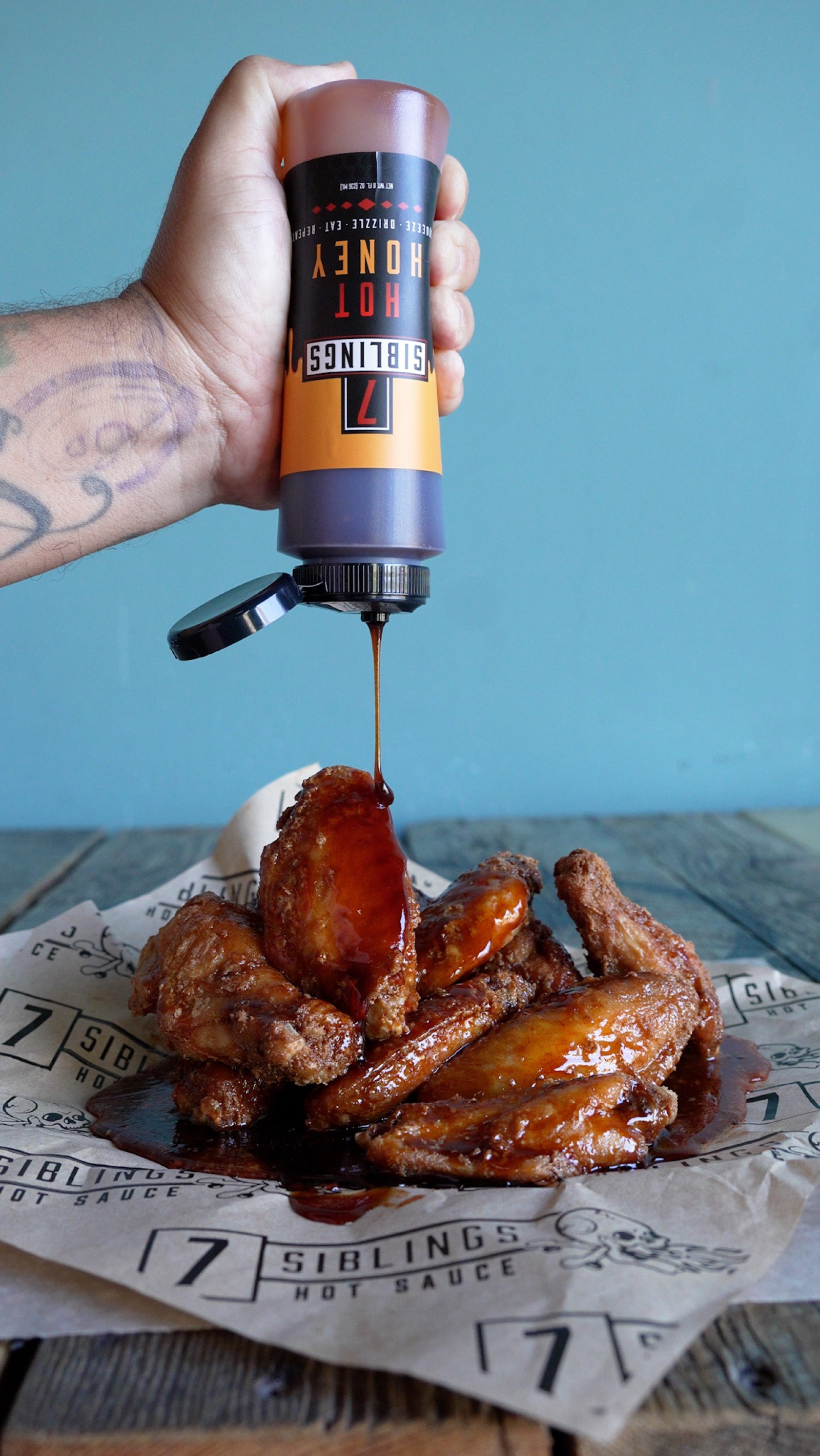 7 Siblings Hot Honey drizzled over crispy chicken wings